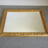 A gilt framed wall mirror,