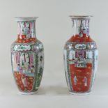 A pair of Chinese porcelain vases, decorated with figures,