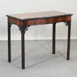 A 19th century mahogany serpentine side table,