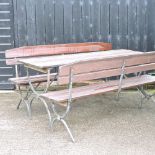 A Bierkeller style folding garden table, together with a pair of matching folding benches,