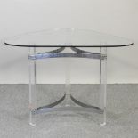 A contemporary chrome and lucite side table, with a glass top,