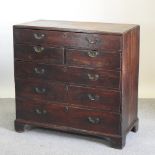 A large George III oak chest, containing an arrangement of six drawers,