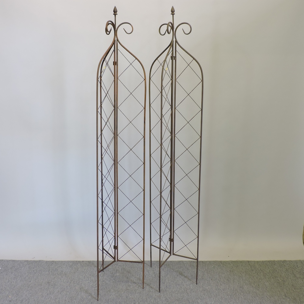 A pair of folding garden lattice spires,