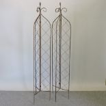 A pair of folding garden lattice spires,