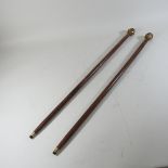 A pair of reproduction Buddha walking sticks,