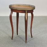 An early 20th century French style ormolu mounted occasional table,