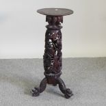 An Eastern carved hardwood jardiniere stand,