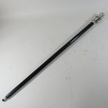 A reproduction walking stick, with a telescope attached,