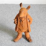 A rusted cast iron garden figure of Mr Ratty,