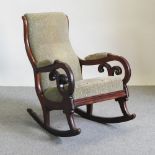 A Victorian mahogany and green upholstered rocking chair