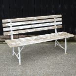A metal and white painted slatted wooden garden bench,
