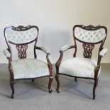 A pair of Edwardian show frame armchairs