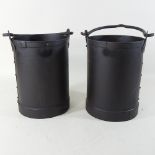 A pair of small metal buckets,