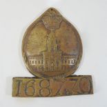 An antique cast iron fire mark, numbered 168770,