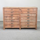 A pine cabinet, containing two short drawers above a pair of cupboard doors,