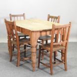 An antique pine table, 117 x 80cm, together with a set of four beech chapel chairs,