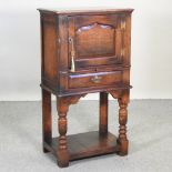 An 18th century style oak cupboard, with an undertier,