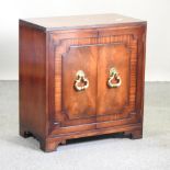 A mahogany cabinet, with brass handles, fitted with slides,