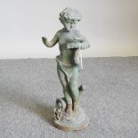 A cast iron garden figure of a putti,
