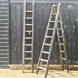 A wooden folding step ladder, together with another larger,