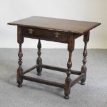 An 18th century oak side table, with a single drawer, on turned legs,