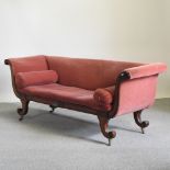 A Regency mahogany and red upholstered sofa, with scrolled ends,