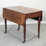 A William IV mahogany pembroke table, on fluted legs,