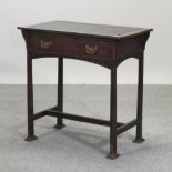 An Arts and Crafts oak writing table,