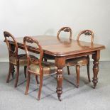 A Victorian mahogany extending dining table, with an additional leaf, and winder, 150 x 105cm,