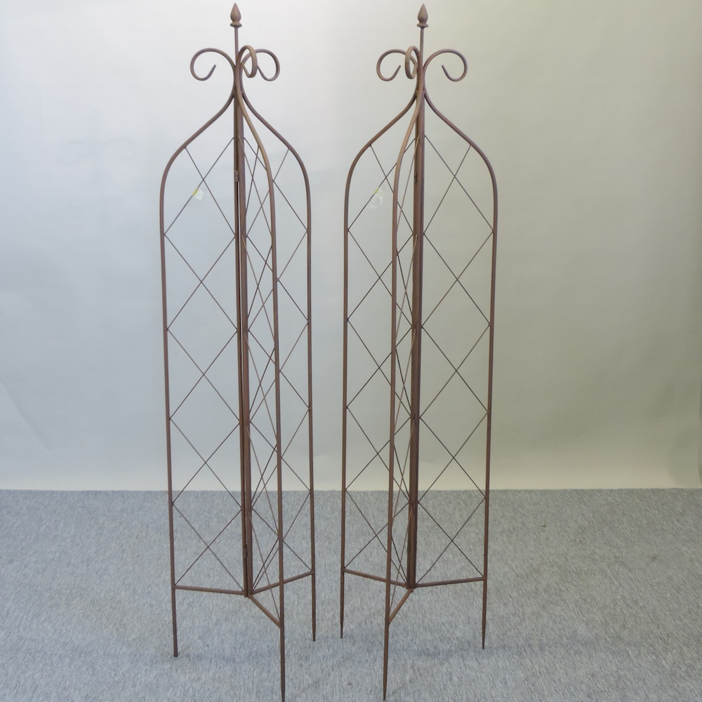 A pair of folding garden lattice spires,