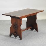 A 19th century style oak coffee table, with carved decoration,