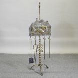 A 19th century brass fireside companion set,