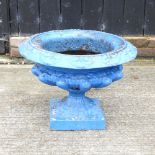 A blue painted cast iron campana shaped garden urn,