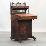 A 19th century rosewood and inlaid davenport,