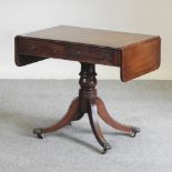 A Regency mahogany sofa table, containing two short drawers, on a splayed base,