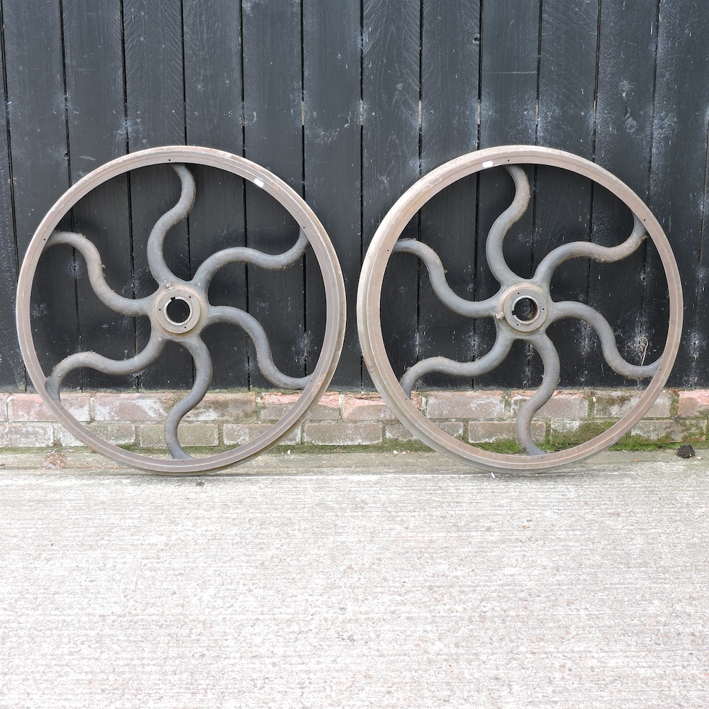 A pair of cast iron industrial wheels,