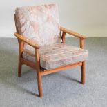 A 1970's teak open armchair,