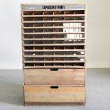 A mid 20th century limed shop display cabinet,