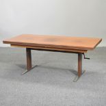 An adjustable teak coffee table, 140 x 65cm,