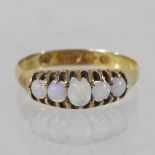 A 15 carat gold opal five stone ring