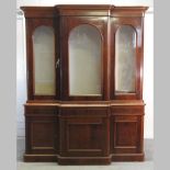 A large Victorian mahogany breakfront glazed library bookcase,