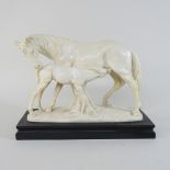 A Santini, a model of a horse and foal, on a marble plinth,