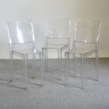A set of three clear perspex ghost chairs,