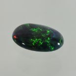 A black opal, approximately 1.