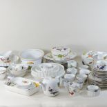 Two shelves of Royal Worcester Evesham pattern tea and dinner wares