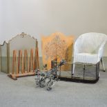 A painted fire screen, together with a brass spark guard, a white Lloyd Loom style chair,