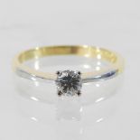 A bespoke 18 carat gold solitaire diamond ring, with platinum shoulders approximately 0.