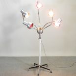 An unusual 1960's aluminium and chrome adjustable salon heat lamp, on castors,