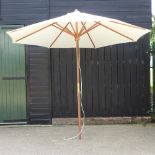 A teak garden parasol,