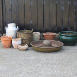 A circular cast iron pig trough, 67cm diameter, together with a milk churn a bucket,